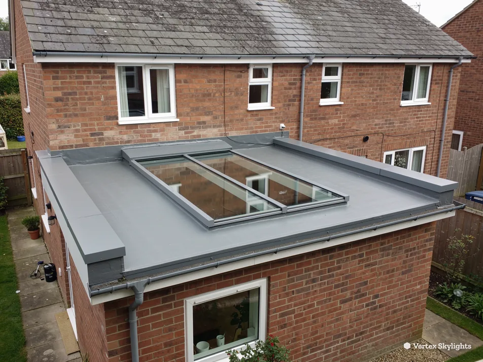 A flat rooflight on a brick rear extension, seen from above