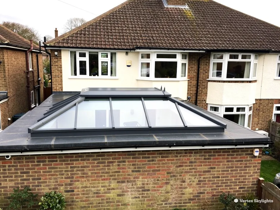 A large roof lantern on a brick extension behind a 1930s semi